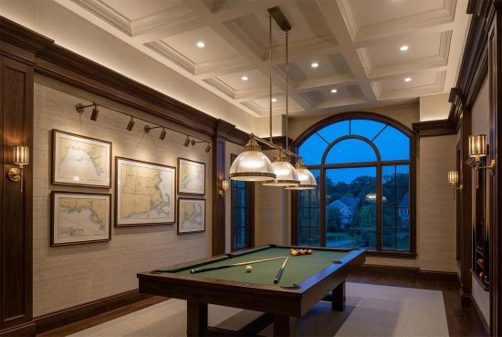Luxurious billiard room with pool table, wood paneling, and coffered ceiling